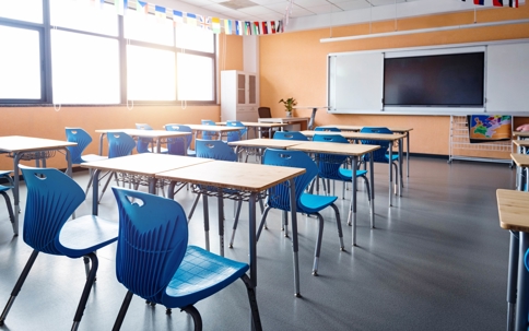 Classroom showing chairs facing a white board