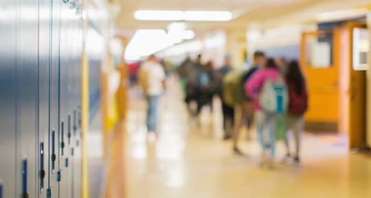 School hallway with kids blurred in the background